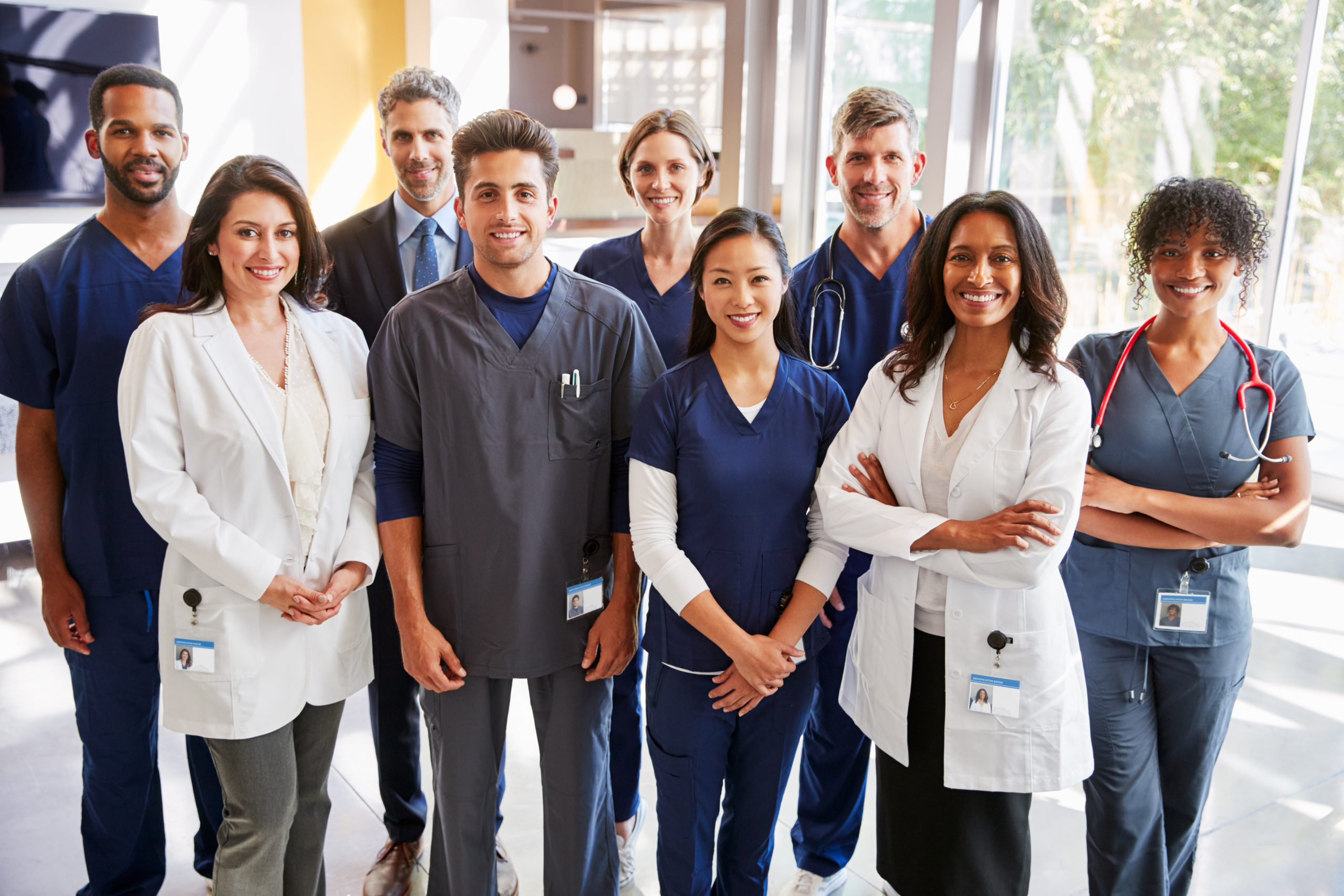 Team,Of,Healthcare,Workers,At,A,Hospital,Smiling,To,Camera